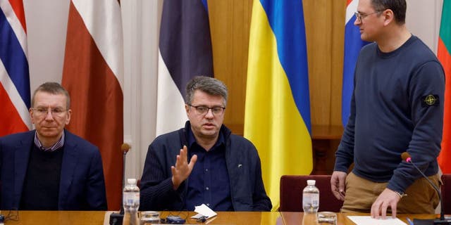 Foreign ministers of Ukraine Dmytro Kuleba, right, Estonia's Urmas Reinsalu, center, and Latvia's Edgars Rinkevics attend a joint news conference in Kyiv, Ukraine, on Nov. 28, 2022.