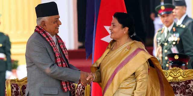 Outgoing President Bidhya Devi Bhandari, right, congratulates Nepal's newly elected president Ram Chandra Poudel, after he took the oath of office in Kathmandu, Nepal, on March 13, 2023. 