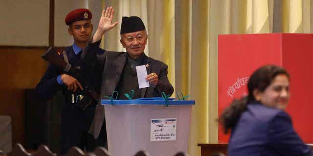 Presidential candidate Subaschandra Nemwang of the Communist Party of Nepal waves before casting his vote for Nepal's new president in Kathmandu, Nepal, on March 9, 2023.