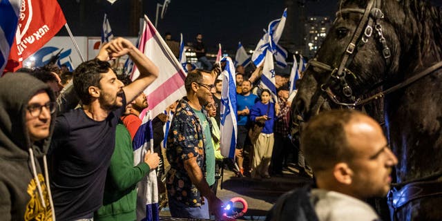 Hundreds of protesters gathered in Tel Aviv outside Sara Netanyahu's hair salon.