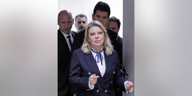 Sara Netanyahu was escorted to a limo after protesters gathered outside her hair salon.