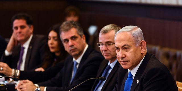 Israeli Prime Minister Benjamin Netanyahu convenes a cabinet meeting at the prime minister's office in Jerusalem, Thursday, Feb. 23, 2023. (Ronen Zvulun/Pool Photo via AP)