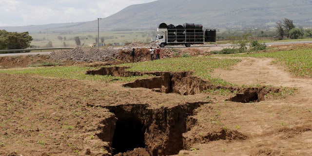 A truck drives close to a chasm near the Rift Valley town of Mai Mahiu, Kenya, March 28, 2018.