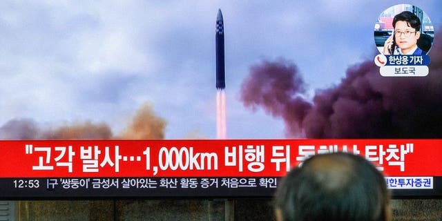 A TV screen at Yongsan railway station shows a news bulletin about one of North Korea's recent long-range ballistic missile launches.