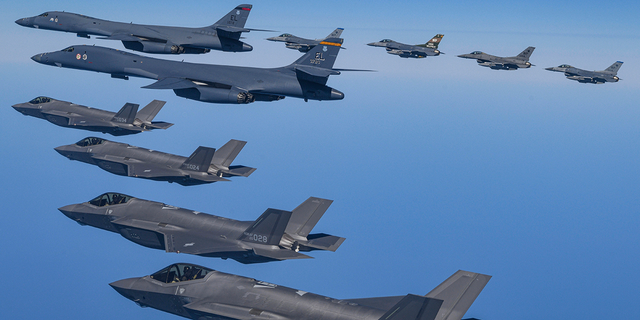 U.S. Air Force B-1B bombers fly in formation with South Korea's Air Force F-35A fighter jets and U.S. Air Force F-16 fighter jets during a military exercise in South Korea, Sunday, March 19, 2023. 