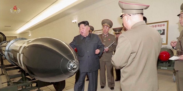 North Korean leader Kim Jong Un inspecting nuclear warheads at an undisclosed location.