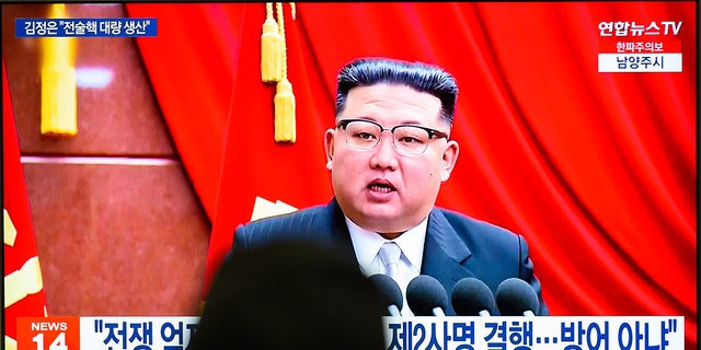 A TV screen shows footage of North Korean leader Kim Jong Un during a news program at the Yongsan Railway Station in Seoul.