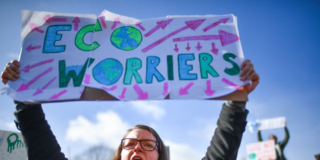 School children participate in a climate change protest outside the Scottish Parliament on March 15, 2019, in Edinburgh, Scotland. 