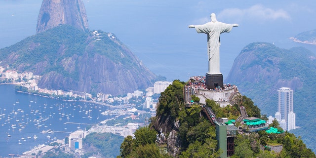 Christ the Redeemer overlooks Rio de Janeiro from atop Corcovado mountain.