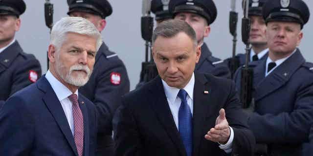 Poland's President Andrzej Duda, right, welcomes Czech Republic's President Petr Pavel as they meet in Warsaw, Poland, on March 16, 2023. Duda announced that Poland was planning to send around a dozen MiG-29 fighter jets to Ukraine.