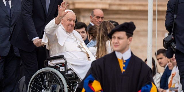 Pope Francis greets and blesses the faithful during a General Audience at St. Peter's Square in Vatican City. 