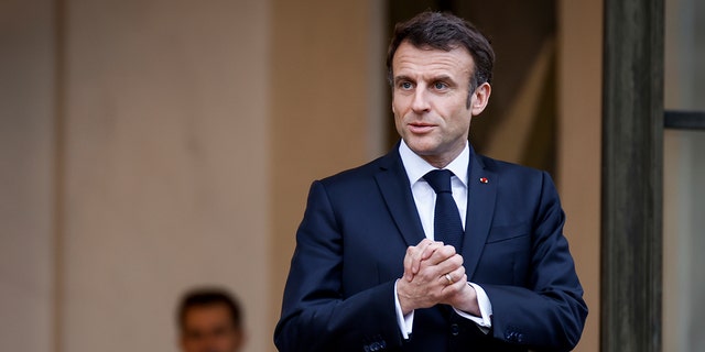 French President Emmanuel Macron talks to the media as he awaits Costa Rican President Rodrigo Chaves Robles for a meeting at the Elysee Palace in Paris, on March 24, 2023.