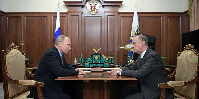 Russian President Vladimir Putin, left, meets with Security Council Secretary Nikolai Patrushev in Moscow June 2017. Patrushev is a close ally of Putin, according to Reuters.