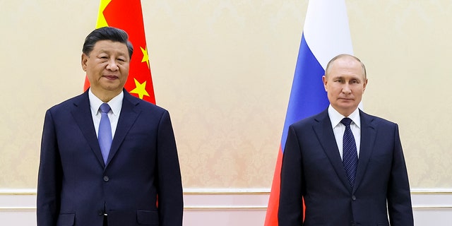 Chinese President Xi Jinping, left, and Russian President Vladimir Putin pose for a photo on the sidelines of the Shanghai Cooperation Organization summit in Samarkand, Uzbekistan.