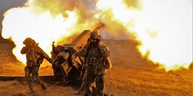 A Ukrainian artillery crew fires on Russian positions near Bakhmut in Ukraine on March 21, 2023.