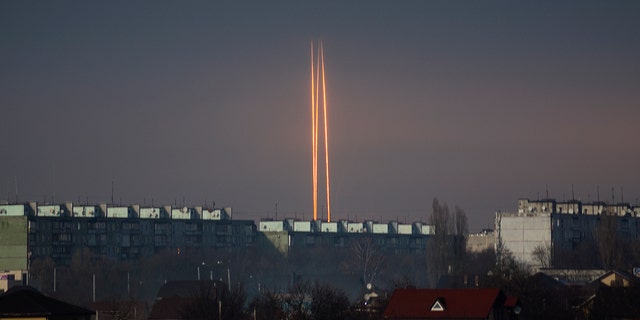 Three Russian rockets launched against Ukraine from Russia's Belgorod region are seen at dawn in Kharkiv, Ukraine, late Thursday, March 9, 2023. 