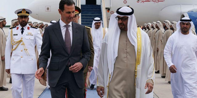 Syrian President Bashar Assad, left, speaks with UAE President Sheikh Mohammed bin Zayed Al-Nahyan, in in Abu Dhabi, United Arab Emirates, Sunday, March 19, 2023. 