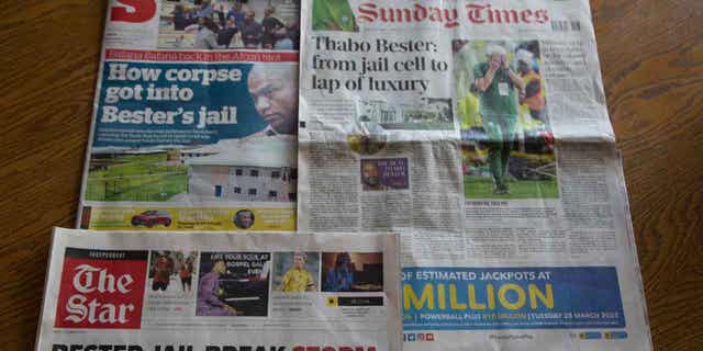 A collage of newspapers report on the story of South African police having launched a manhunt for Thabo Bester, who escaped from a privately-run maximum security prison. Bester was found guilty in 2012 of raping two women and killing one after luring them with Facebook.