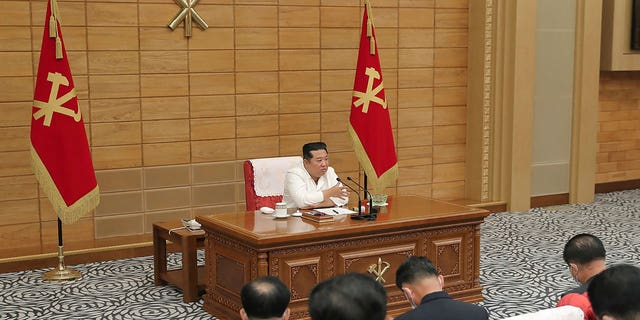 In this photo provided by the North Korean government, Kim Jong Un attends a meeting of the ruling party in Pyongyang.