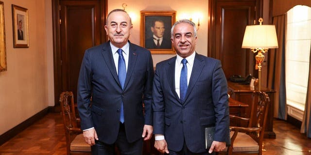 Turkish Foreign Affairs Minister, Mevlut Cavusoglu, left, receives Barzani Charity Foundation President Musa Ahmad in Ankara, Turkiye.