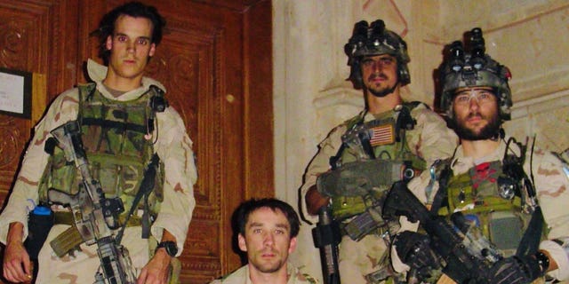 Picture was taken on Nov 26, 2003, after an assault in Tikrit, Iraq. The picture is outside the team's Mission Support Site in Tikrit roughly two weeks before the capture of Saddam Hussein. Pictured left to right, Chris VanSant, Mike Hefner, Brad Thomas and Craig Palmer.