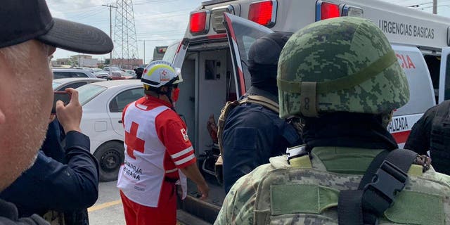 On Tuesday, March 7, 2023, a Red Cross worker closes the door of an ambulance carrying two Americans found alive after their abduction in Mexico last week in Matamoros.
