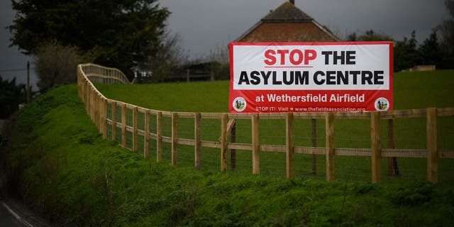 A sign at the entrance of the village of Wethersfield, where the British government is planing to house asylum seekers at a former RAF base, on March 29, 2023.