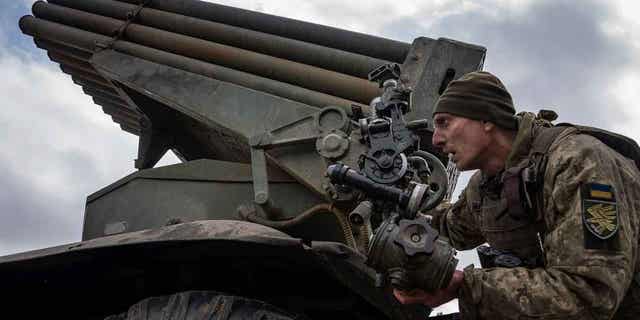 A Ukrainian paratrooper aims to fire by MSLR BM-21 "Grad" towards Russian positions at the frontline near Kreminna, Ukraine, on March 9, 2023. Ukraine was the third-largest importer of arms in 2022.