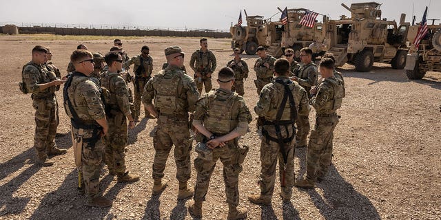 U.S. Army soldiers prepare to go out on patrol from a remote combat outpost on May 25, 2021, in northeastern Syria. U.S. forces, part of Task Force WARCLUB, operate from combat outposts in the area, coordinating with the Kurdish-led Syrian Democratic Forces (SDF) in combatting residual ISIS extremists and deterring pro-Iranian militia.  