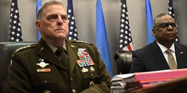 Defense Secretary Lloyd Austin, right, and Chairman of the Joint Chiefs of Staff General Mark Milley attend a virtual meeting of the Ukraine Defense Contact Group on March 15, 2023, at the Pentagon in Washington, D.C.