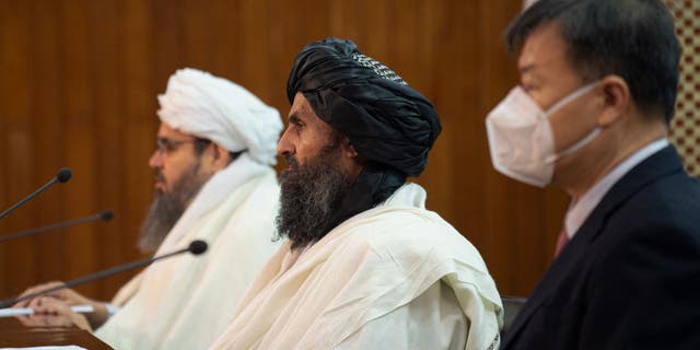 Shahabuddin Dilawar, acting minister of mines and petroleum, left; Abdul Ghani Baradar, Afghanistan's acting first deputy prime minister, center; and Wang Yu, China's ambassador to Afghanistan, attend a press conference to announce an oil extraction contract with a Chinese company in Kabul Jan. 5, 2023. 