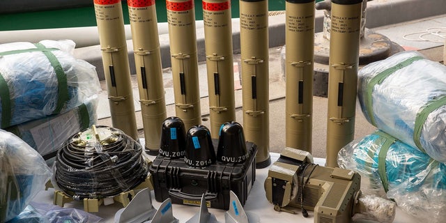 Anti-tank guided missiles and medium-range ballistic missile components are seen at a military facility in the U.S. 5th Fleet area of operations on Feb. 26, following the seizure in the Gulf of Oman.