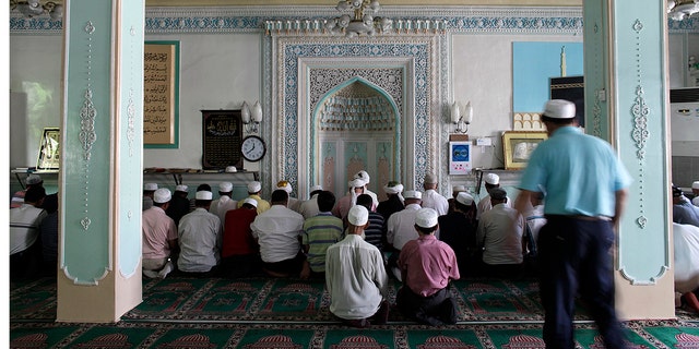 Ethnic Uighurs pray inside a mosque in Urumqi in China's Xinjiang Autonomous Region. 