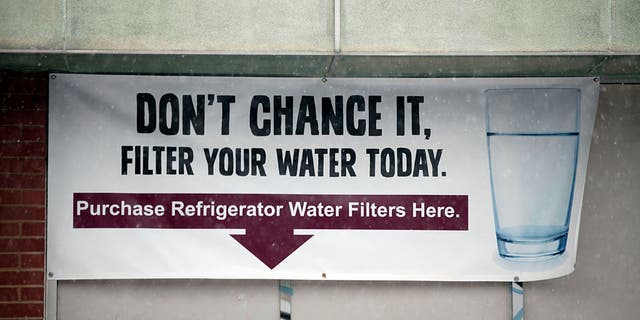 A sign warns residents to filter their water on Jan. 17, 2016, in Flint, Michigan.
