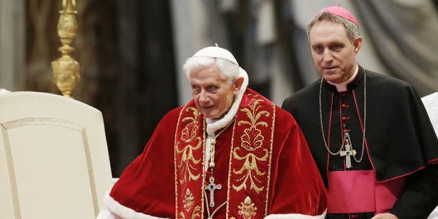 Pope Benedict XVI flanked by personal secretary Archbishop Georg Gaenswein during a mass.