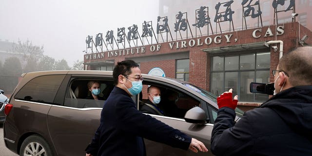 Members of the World Health Organization team tasked with investigating the origins of the coronavirus disease arrive at the Wuhan Institute of Virology in Wuhan, China.