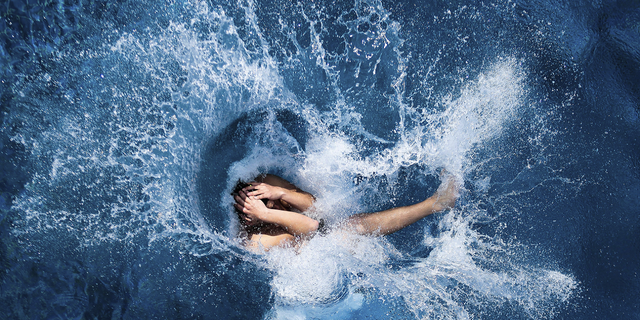 A boy jumps into the water at the open air public pool in Berlin, Germany, in 2014. Women in the city will soon be able to go topless at its public pools, officials say. 