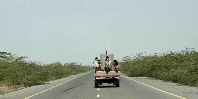Saudi-backed forces are pictured in a vehicle in Hodeida, Yemen, on Feb. 12, 2018. Yemen’s warring sides have agreed to release nearly 900 prisoners of war in a United Nations-brokered deal.