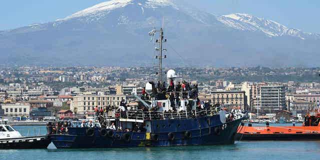 A ship carrying around 700 migrants enters the Sicilian port of Catania, on April 12, 2023. The United Nation migration agency reported 2023 has been a deadly year for migrants crossing the central Mediterranean Sea.