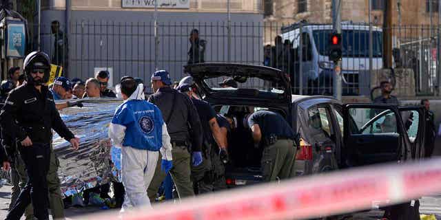 Israeli police examine the scene of a car ramming attack
