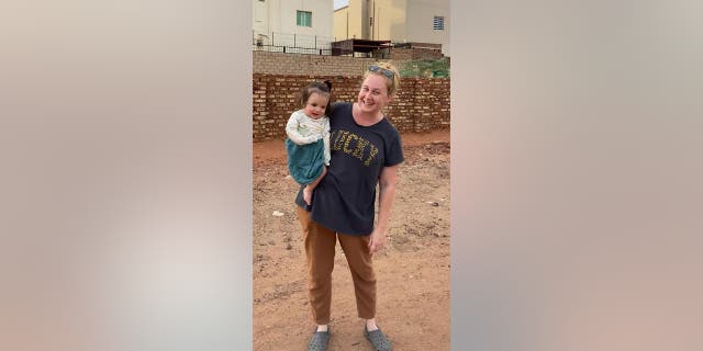 American woman and child in Sudan