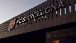 This photograph taken on August 5, 2021 shows the logo of FC Barcelona on the facade of the Camp Nou stadium in Barcelona. - Lionel Messi will end his 20-year career with Barcelona after the Argentine superstar failed to reach agreement on a new deal with the club, the Spanish giants announced on August 5, 2021. (Photo by Pau BARRENA / AFP) (Photo by PAU BARRENA/AFP via Getty Images)