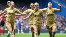 Caroline Graham Hansen of FC Barcelona celebrates with teammates after scoring the team's first goal during the UEFA Women's Champions League semifinal 1st leg match between Chelsea FC and FC Barcelona at Stamford Bridge on April 22, 2023 in London, England.