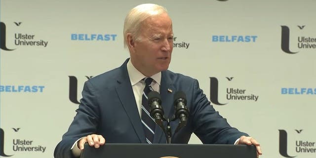 President Joe Biden speaking in front of a crowd at Ulster University in Northern Ireland on April 12, 2023.