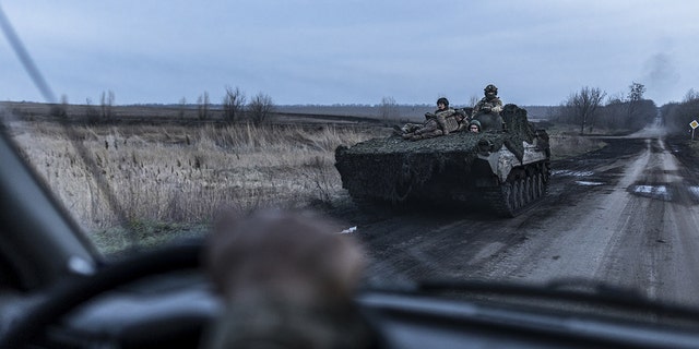 Soldiers on a BMP move near Chasiv Yar, Donetsk oblast, on April 4, 2023.