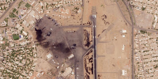A satellite photo shows damaged aircraft at Sudan's Khartoum International Airport. Fighting reportedly continued in the Sudanese capital Tuesday despite international efforts to broker a truce between two rival generals' factions.