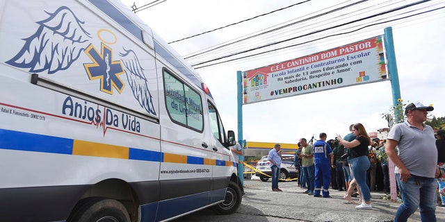 An ambulance is parked outside the private day care center Cantinho do Bom Pastor after the attack in Blumenau, Brazil.