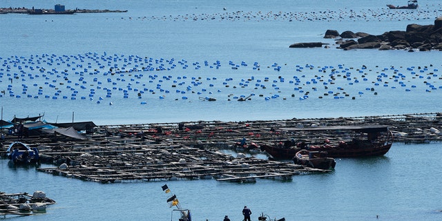 A boat moves through the water at the 68-nautical-mile scenic spot, the closest point in mainland China to the island of Taiwan, in Pingtan in southeastern China's Fujian Province on Aug. 5, 2022.