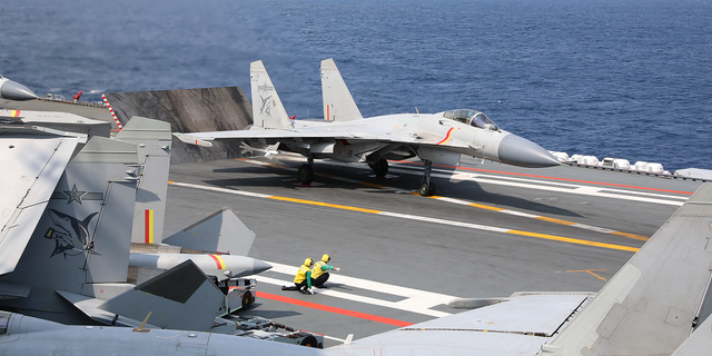A J-15 fighter is seen ready to take off from aircraft carrier Shandong on April 9 during the combat readiness patrol and military exercises around the Taiwan Island carried out by the Eastern Theater Command of the Chinese People's Liberation Army.