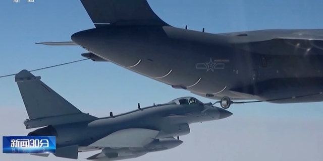 In this image taken from video footage run Saturday, April 8, 2023 by China's CCTV, a Chinese fighter jet performs an mid-air refueling maneuver at an unspecified location. The Chinese military announced exercises around Taiwan on Saturday in a new act of retaliation for a meeting between the U.S. House of Representatives speaker and the president of the self-ruled island democracy claimed by Beijing as part of its territory. 
